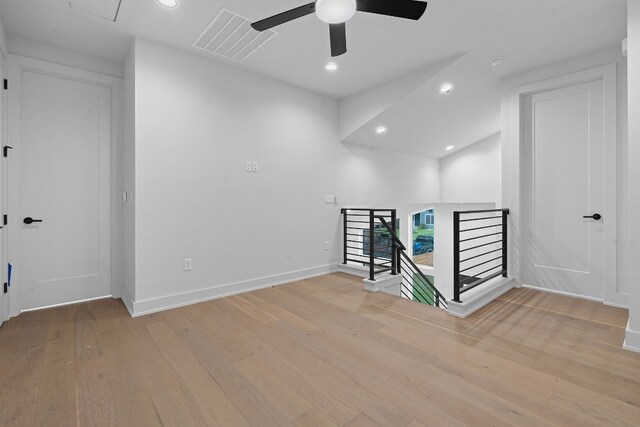 spare room featuring light hardwood / wood-style flooring and ceiling fan