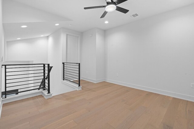 unfurnished room featuring ceiling fan and light hardwood / wood-style flooring