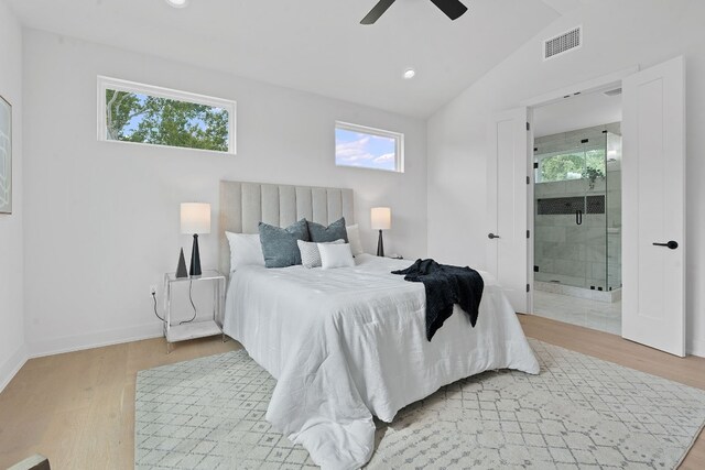 bedroom with ceiling fan, light wood-type flooring, and multiple windows