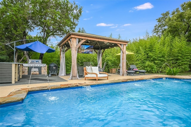 view of swimming pool featuring a gazebo, grilling area, a patio area, and pool water feature