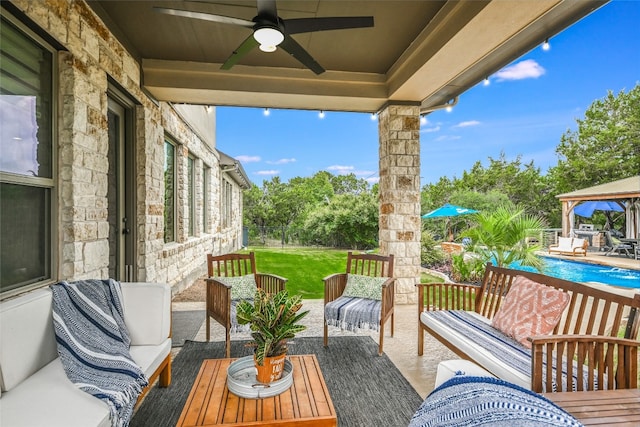 view of patio / terrace featuring an outdoor living space, a gazebo, and ceiling fan