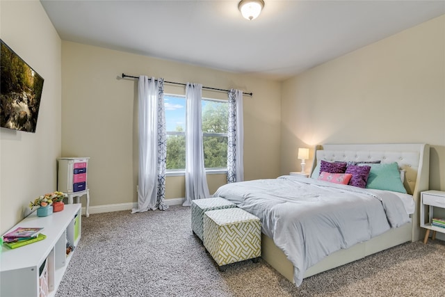 bedroom featuring carpet flooring and baseboards