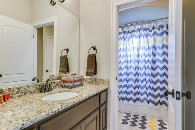 bathroom featuring vanity and shower / tub combo