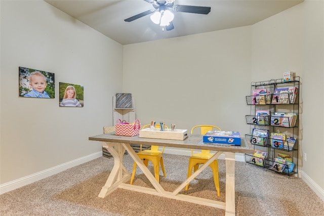 recreation room with carpet, ceiling fan, and baseboards