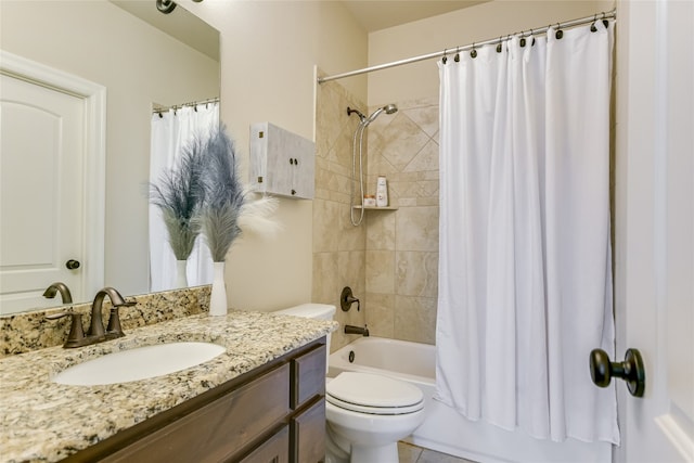 full bath with shower / bath combo, vanity, and toilet