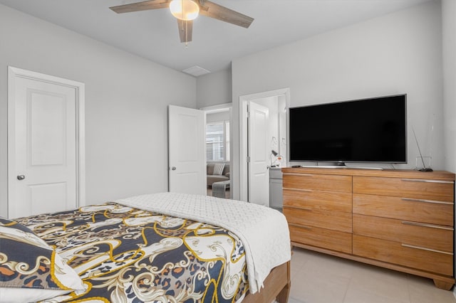 bedroom with ceiling fan and light tile patterned flooring