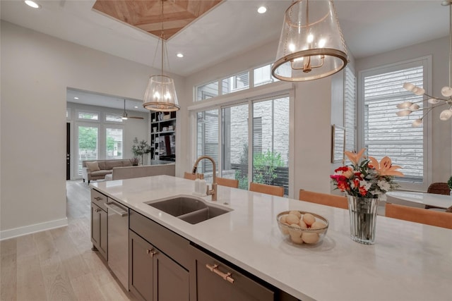 4209 Elevator Dr, Austin, TX 78731 - kitchen featuring a chandelier, a sink, recessed lighting, light wood-style flooring, and open floor plan