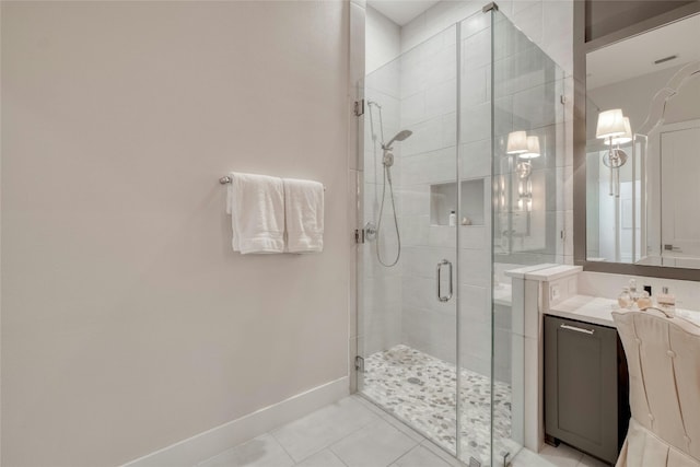 4209 Elevator Dr, Austin, TX 78731 - bathroom with a stall shower, tile patterned floors, vanity, and baseboards