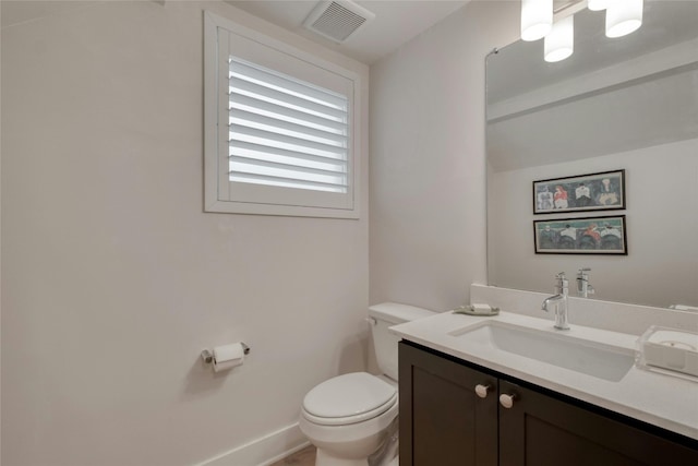 4209 Elevator Dr, Austin, TX 78731 - bathroom featuring toilet, vanity, and baseboards