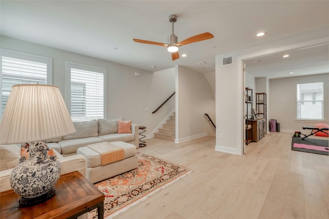 4209 Elevator Dr, Austin, TX 78731 - living area with light wood-type flooring, recessed lighting, a ceiling fan, baseboards, and stairway