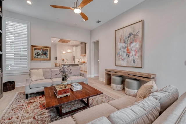 4209 Elevator Dr, Austin, TX 78731 - living area featuring a ceiling fan, baseboards, recessed lighting, and light wood-style floors