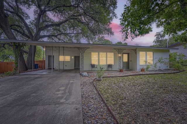 ranch-style house with a carport