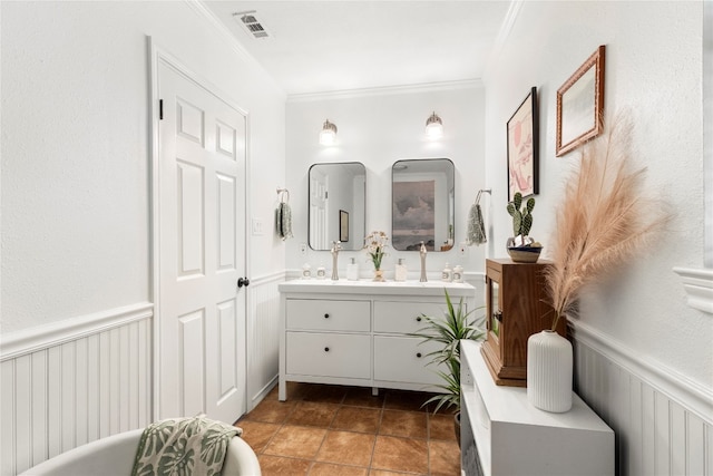 bathroom featuring ornamental molding, vanity, and tile patterned floors