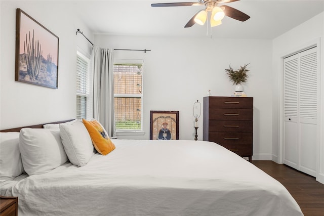 bedroom featuring a closet, ceiling fan, and dark hardwood / wood-style floors