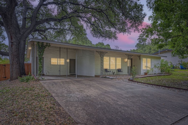 ranch-style house with a carport