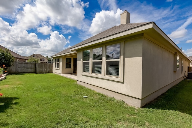 view of home's exterior featuring a yard