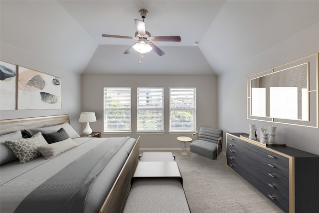 carpeted bedroom with ceiling fan and lofted ceiling