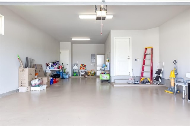 garage with electric panel and a garage door opener