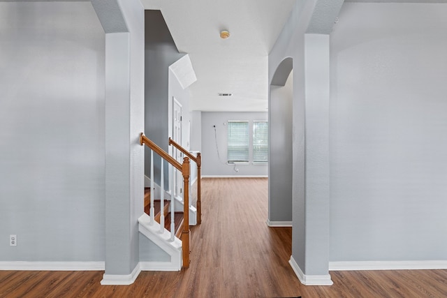 corridor featuring hardwood / wood-style floors