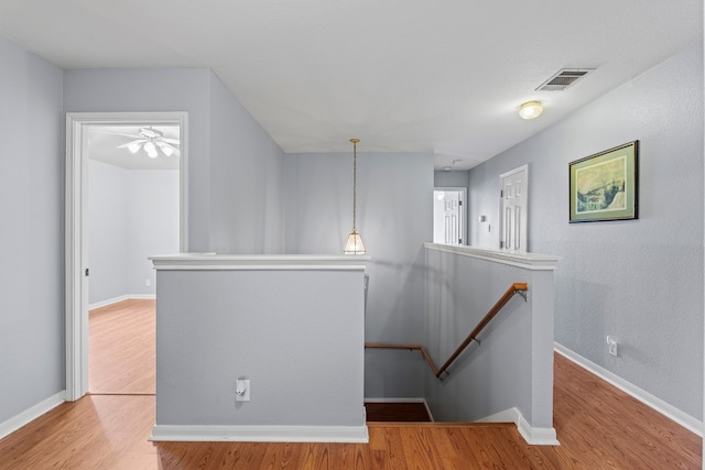 stairway featuring hardwood / wood-style flooring