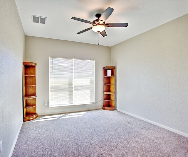 carpeted empty room with ceiling fan