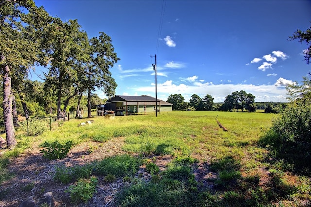 view of yard with a rural view