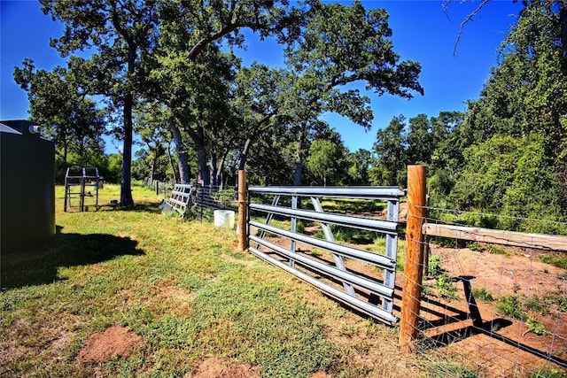 view of gate featuring a lawn