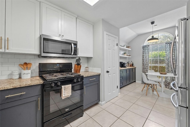 kitchen with gray cabinets, white cabinets, lofted ceiling, and stainless steel appliances