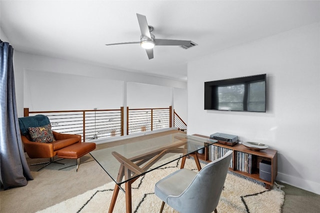 office area featuring light carpet and ceiling fan