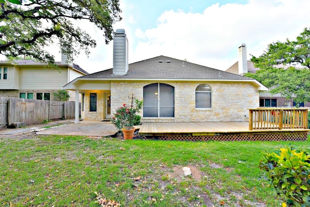 back of property with a patio area, a yard, and a deck