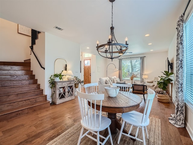 dining area featuring a chandelier and hardwood / wood-style flooring