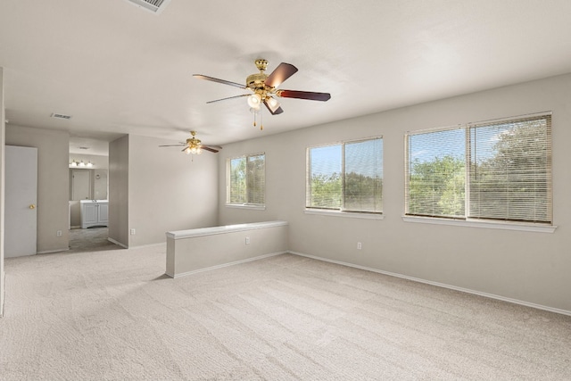 empty room with light carpet and ceiling fan