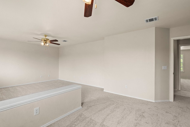 unfurnished room with ceiling fan and carpet floors