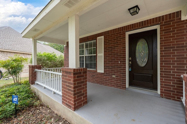 doorway to property with covered porch