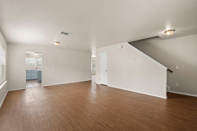 spare room with hardwood / wood-style flooring