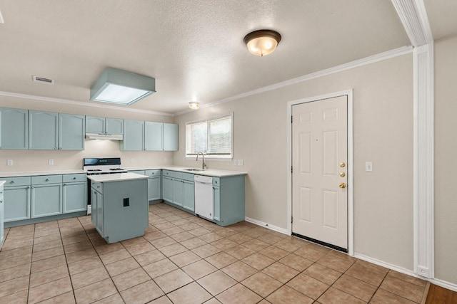 kitchen featuring a kitchen island, white appliances, light tile patterned floors, ornamental molding, and sink