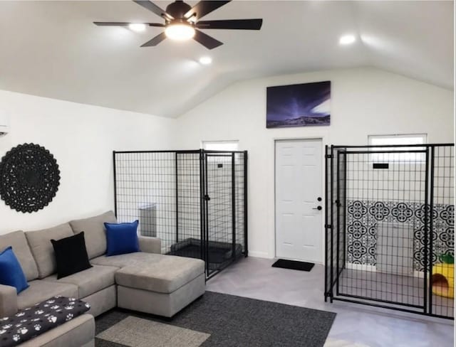 living room featuring ceiling fan and lofted ceiling