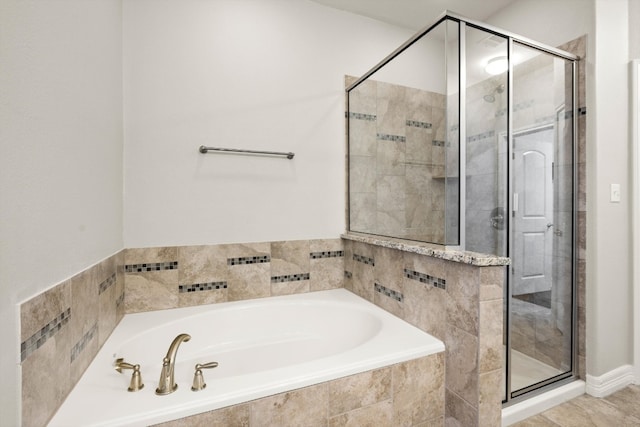 bathroom with shower with separate bathtub