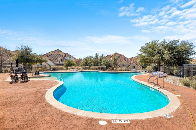 view of swimming pool with a patio