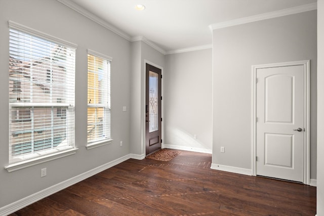 unfurnished room with a wealth of natural light, dark hardwood / wood-style flooring, and crown molding