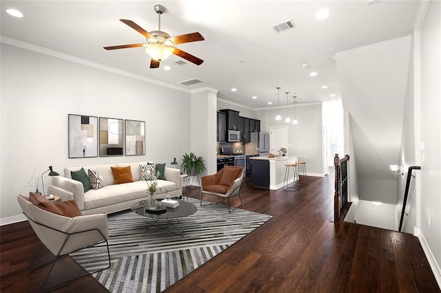 living room featuring ceiling fan, dark hardwood / wood-style floors, and crown molding