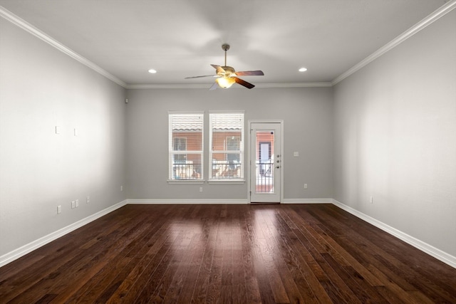 spare room with dark wood-type flooring, ceiling fan, and ornamental molding