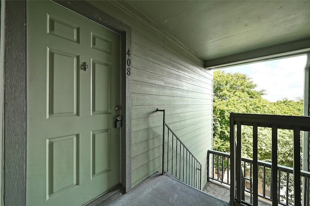 property entrance with a balcony