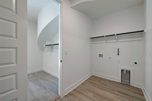 laundry room featuring electric dryer hookup, gas dryer hookup, hookup for a washing machine, and light wood-type flooring