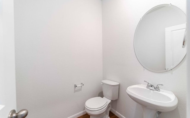 bathroom featuring sink and toilet