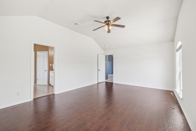 unfurnished room with vaulted ceiling, ceiling fan, and dark hardwood / wood-style flooring