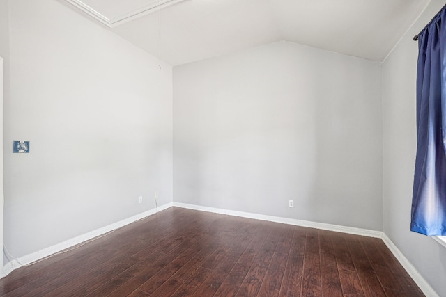 empty room with lofted ceiling and hardwood / wood-style floors