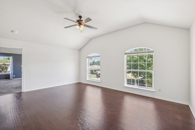 unfurnished room featuring lofted ceiling, ceiling fan, and dark wood-type flooring