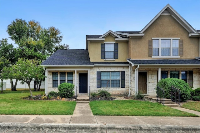 view of front of property with a front yard and a porch