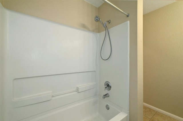 bathroom with tile patterned floors and shower / bathtub combination